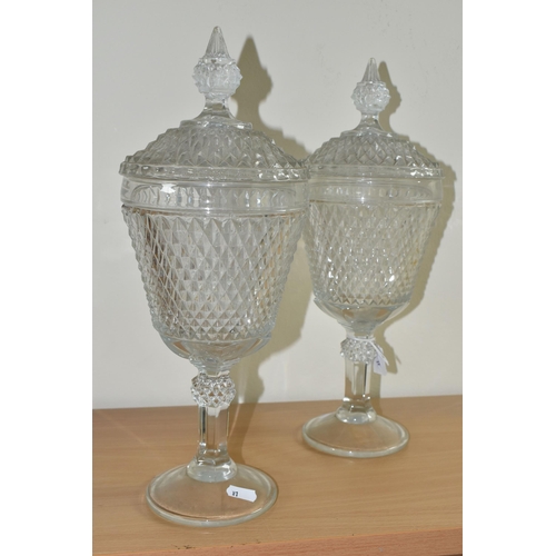 383 - A PAIR OF LATE 20TH CENTURY AMERICAN 'INDIANA GLASS' CLEAR PRESSED GLASS JARS AND COVERS OF CHALICE ... 