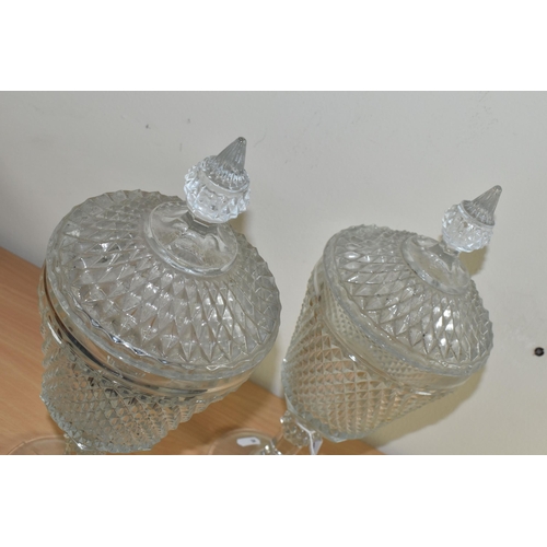 383 - A PAIR OF LATE 20TH CENTURY AMERICAN 'INDIANA GLASS' CLEAR PRESSED GLASS JARS AND COVERS OF CHALICE ... 