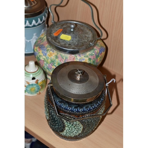 388 - FOUR CERAMIC BISCUIT BARRELS, comprising a Royal Doulton Lambeth Ware barrel decorated with a green ... 