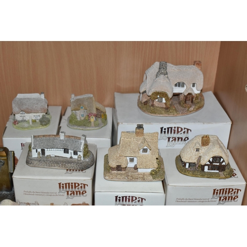 390 - A GROUP OF BOXED LILLIPUT LANE COTTAGES AND ORNAMENTS, comprising an Austrian cold painted spelter t... 