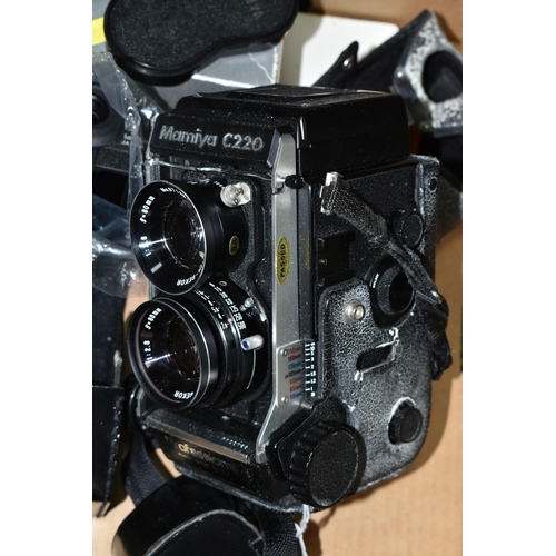 395 - A MAMIYA C220 PROFFESSIONAL F TLR CAMERA with 80mm f2.8 lenses fitted, a set of 65mm f3.5 lenses, ma... 