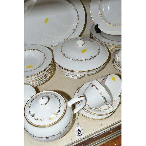 403 - A ROYAL WORCESTER 'GOLD CHANTILLY' PATTERN DINNER SET, comprising eight dinner plates, one meat plat... 