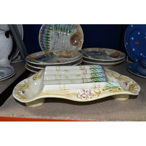 410 - A SET OF FRENCH ASPARAGUS DISHES, comprising a serving dish, length 37cm x width 21.5cm, and six ind... 