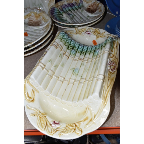 410 - A SET OF FRENCH ASPARAGUS DISHES, comprising a serving dish, length 37cm x width 21.5cm, and six ind... 