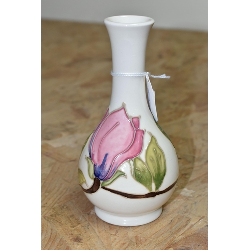 452 - A MOORCROFT POTTERY MAGNOLIA VASE, of bottle form, decorated with tube lined pink Magnolia pattern o... 