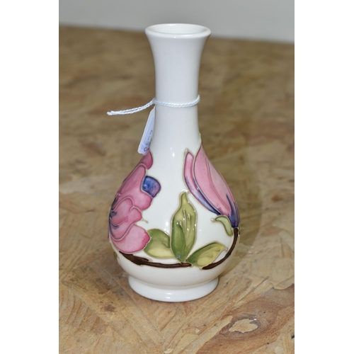 452 - A MOORCROFT POTTERY MAGNOLIA VASE, of bottle form, decorated with tube lined pink Magnolia pattern o... 