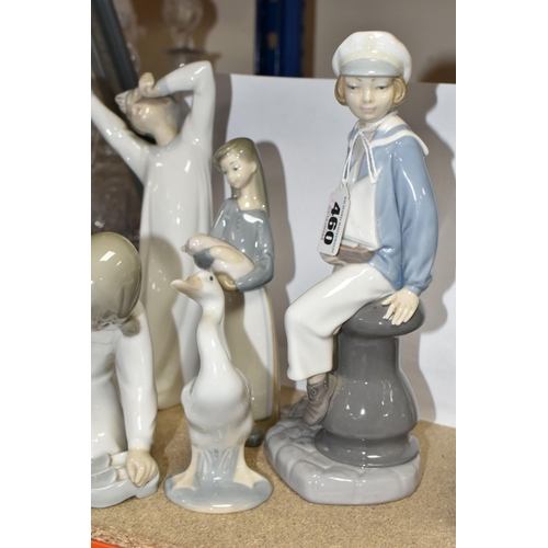 460 - FIVE LLADRO FIGURES, comprising Boy with Yacht model no 4810, sculptor Salvador Furio, issued 1972-1... 