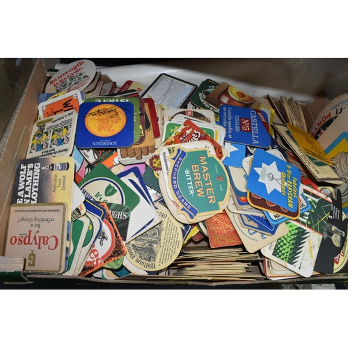 472 - TWO BOXES OF ANNUALS AND BEER MATS, to include twenty six books, mainly annuals including Football A... 