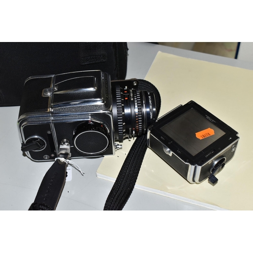 483 - A HASSELBLAD 500C/M MEDIUM FORMAT FILM CAMERA fitted with a Carl Zeiss Planar 80mm f2.8 lens, two fi... 