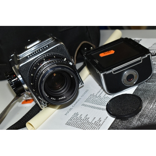 483 - A HASSELBLAD 500C/M MEDIUM FORMAT FILM CAMERA fitted with a Carl Zeiss Planar 80mm f2.8 lens, two fi... 