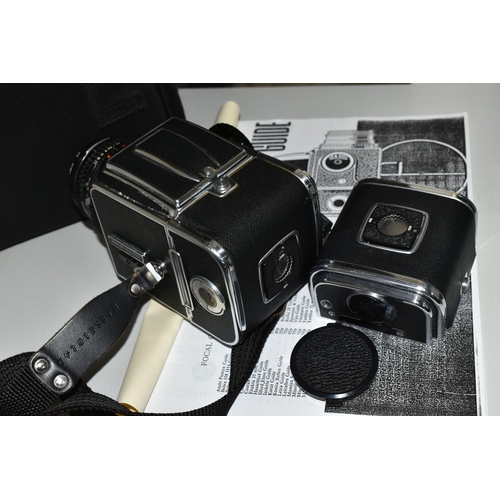 483 - A HASSELBLAD 500C/M MEDIUM FORMAT FILM CAMERA fitted with a Carl Zeiss Planar 80mm f2.8 lens, two fi... 