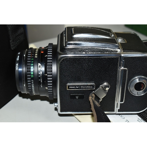 483 - A HASSELBLAD 500C/M MEDIUM FORMAT FILM CAMERA fitted with a Carl Zeiss Planar 80mm f2.8 lens, two fi... 