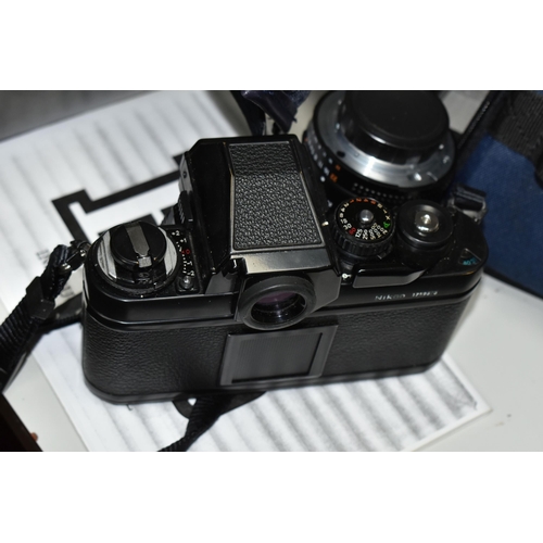 499 - A NIKON F4 VINTAGE FILM SLR CAMERA BODY, a Nikon F3 Film camera body, a 50mm f1.8 lens, an AF 50mm f... 