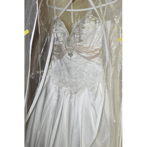 534 - NINE WEDDING DRESSES, all end of season stock clearance, assorted styles and sleeves, Ivory and whit... 