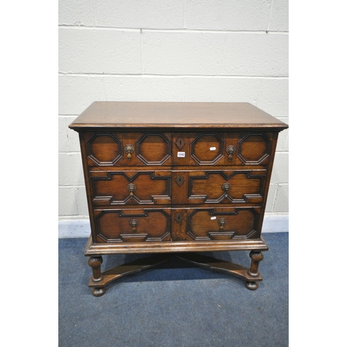 1192 - A JACOBEAN STYLE OAK TWO DOOR TV CABINET, on turned legs, united by a stretcher, width 91cm x depth ... 