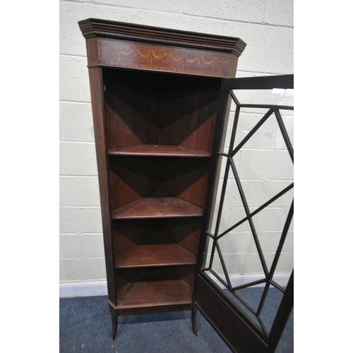 1196 - AN EDWARDIAN MAHOGANY AND MARQUETRY INLAID ASTRAGAL GLAZED SINGLE DOOR CORNER CUPBOARD, enclosing th... 