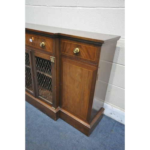 1205 - A REPRODUCTION REGENCY STYLE BREAKFRONT SIDEBOARD, with three drawers and four cupboard doors, two d... 