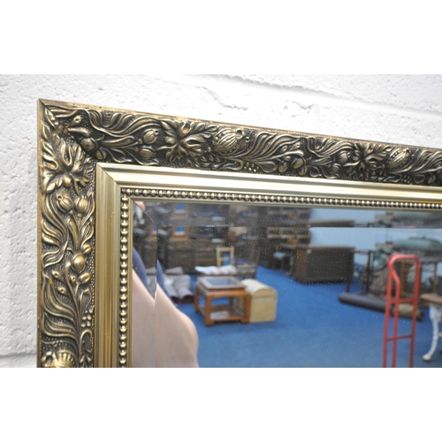 1218 - A LARGE GILT FRAMED BEVELLED  EDGE WALL MIRROR,  137cm x 86cm