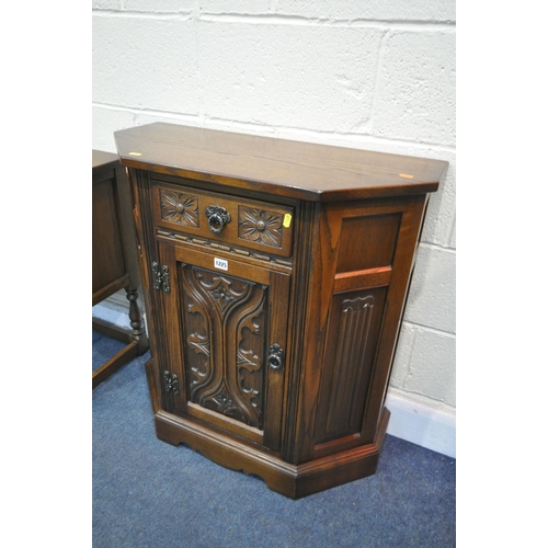 1225 - AN OLD CHARM OAK CANTED SINGLE DOOR CABINET, with a single draw, width 77cm x depth 34cm x height 82... 