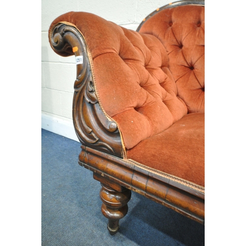 1252 - A VICTORIAN MAHOGANY CHAISE LONGUE, with red buttoned fabric, on turned legs and ceramic casters, Le... 