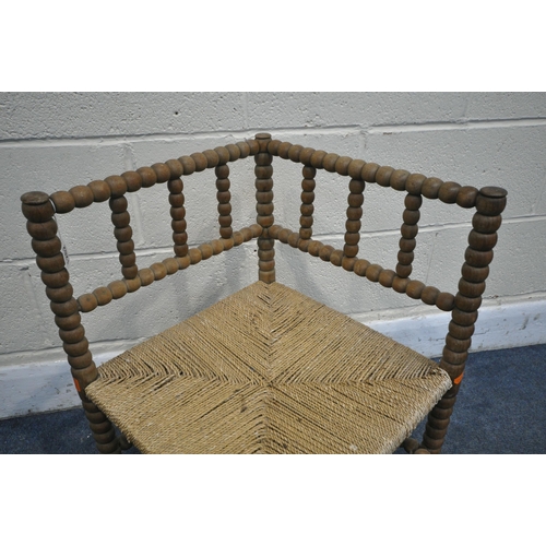 1262 - A WILLIAM MORRIS STYLE BEECH BOBBIN TURNED CORNER CHAIR, with a rush seat (condition:- worn finish, ... 