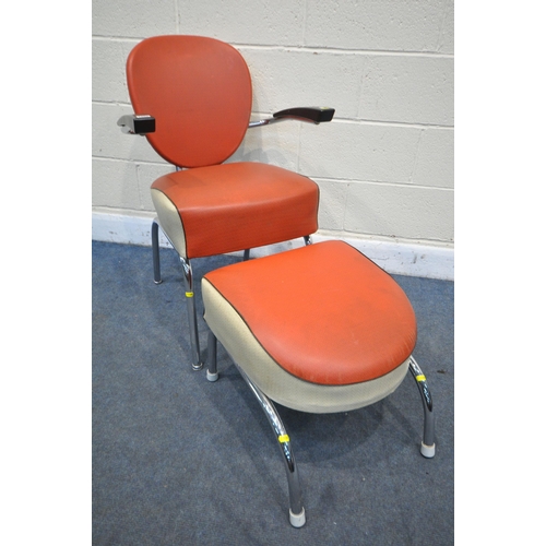 1268 - A MID-20TH CENTURY RED AND CREAM LEATHERETTE AMERICAN TYPE ARMCHAIR, with Bakelite armrests, on a ch... 