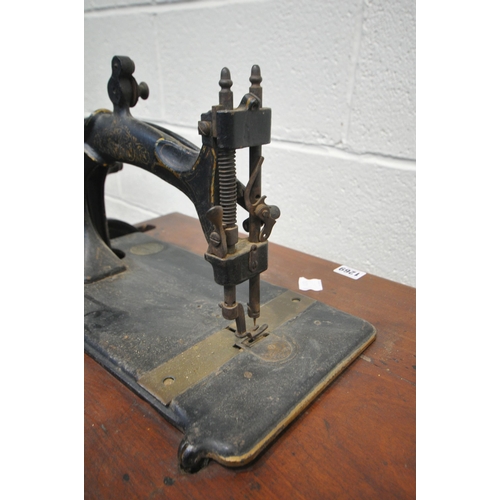 1269 - A LATE 19TH/EARLY 20TH CENTURY HURTU FRENCH CAST IRON TREADLE SEWING MACHINE, width 69cm x depth 44c... 