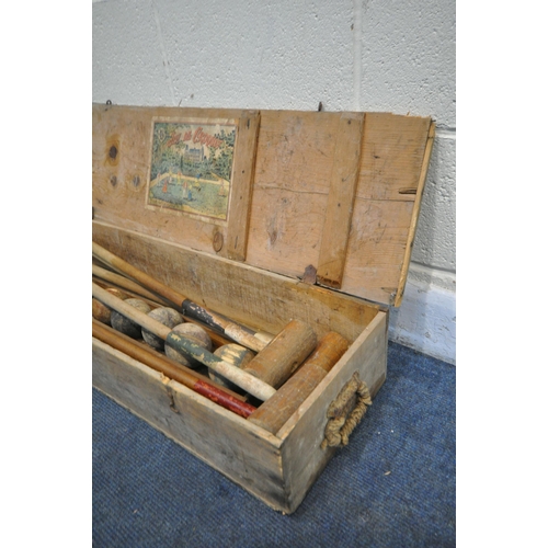 1272 - A VINTAGE FRENCH CROQUET SET, in a pine case, the inner lid reading 'Jeu De Croquet' (condition:- in... 