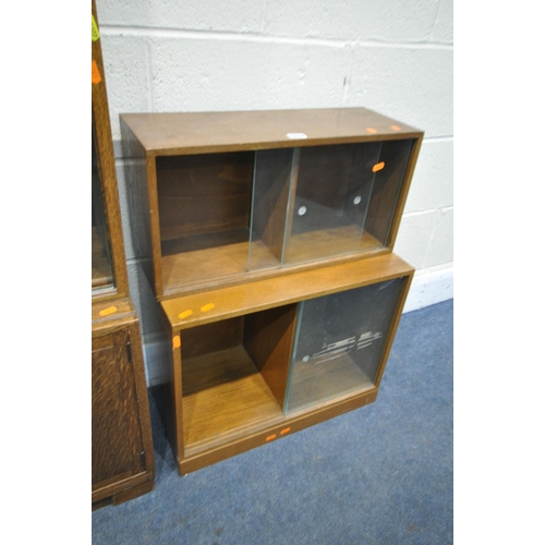 1277 - A 20TH CENTURY MINTY OAK SECTIONAL BOOKCASE, with sliding glazed doors and double cupboard doors wid... 