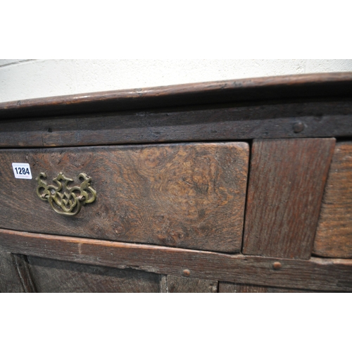 1284 - A LATE GEORGIAN OAK DRESSER BASE, three drawers and two cupboard doors, width 139cm x depth 47cm x h... 