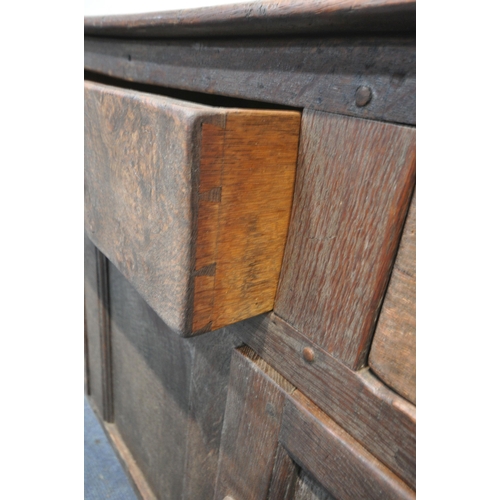 1284 - A LATE GEORGIAN OAK DRESSER BASE, three drawers and two cupboard doors, width 139cm x depth 47cm x h... 