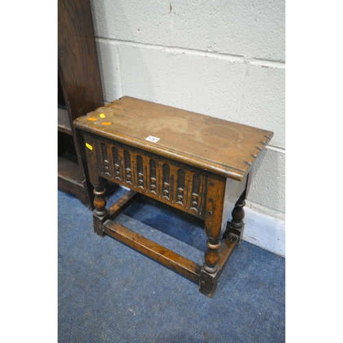 1297 - A REPRODUCTION OAK STORAGE STOOL, along with a small oak open bookcase (condition:- water damage to ... 