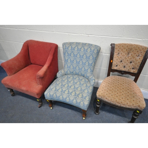 1301 - AN 20TH CENTURY RED UPHOLSTERED ARMCHAIR, on ceramic castors, along with a blue upholstered chair on... 