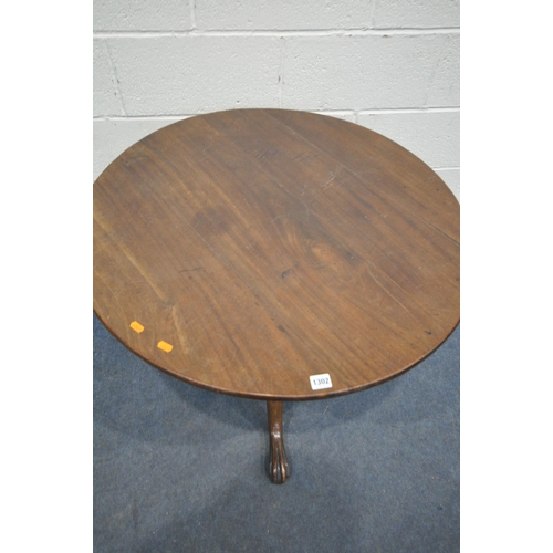 1302 - A GEORGIAN AND LATER MAHOGANY CIRCULAR TILT TOP TRIPOD TABLE, with fluted support on triple scrolled... 