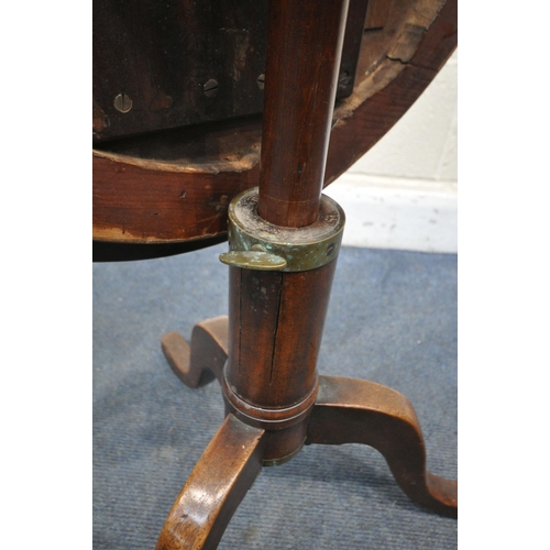 1303 - A GEORGIAN AND LATER WALNUT AND MAHOGANY CAMPAIGN TRIPOD TABLE, the circular top on a screw tilting ... 