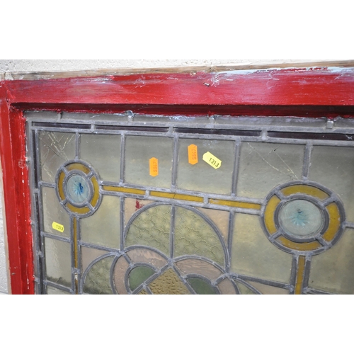 1313 - A PAIR OF ARTS AND CRAFTS COLOURED LEAD GLAZED WINDOWS, within a wooden frame, frame measurements 64... 