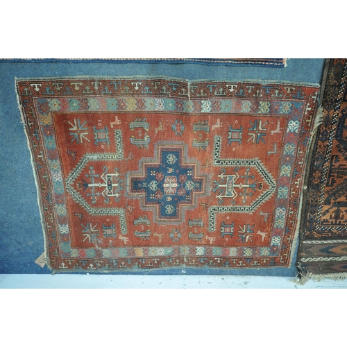 1319 - THREE ANTIQUE EASTERN PERSIAN WOOLLEN RUGS, of various patterns and colours, largest rug measurement... 