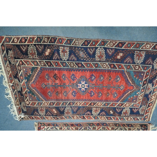 1320 - TWO SIMILAR PERSIAN KAZAK RUGS, made up of red and blue fields largest rug measurement  214cm x 125c... 