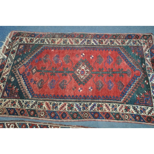 1320 - TWO SIMILAR PERSIAN KAZAK RUGS, made up of red and blue fields largest rug measurement  214cm x 125c... 