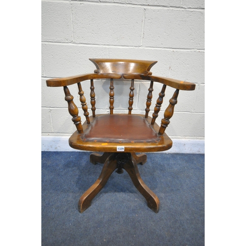 1329 - AN EARLY TO MID 20TH CENTURY BEECH SWIVEL OFFICE CAPTAINS ARMCHAIR, on four legs (condition:-aged we... 