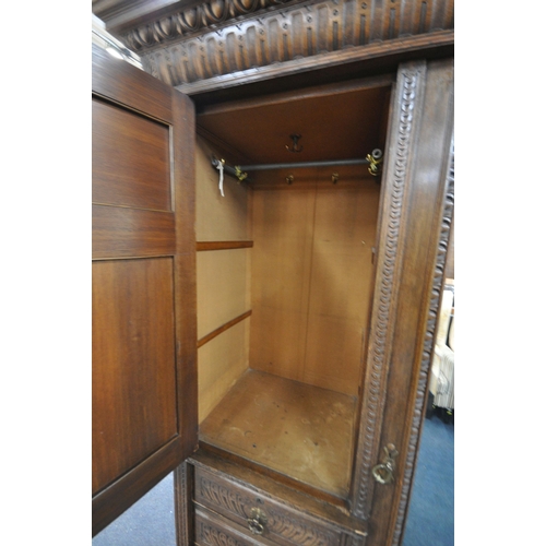 1334 - AN EARLY 20TH CENTURY HAMPTON AND SONS OF PALL MALL EAST LONDON, CARVED OAK COMPACTUM WARDROBE, comp... 