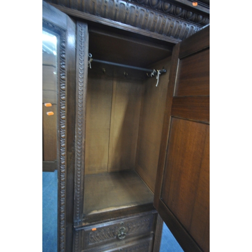 1334 - AN EARLY 20TH CENTURY HAMPTON AND SONS OF PALL MALL EAST LONDON, CARVED OAK COMPACTUM WARDROBE, comp... 