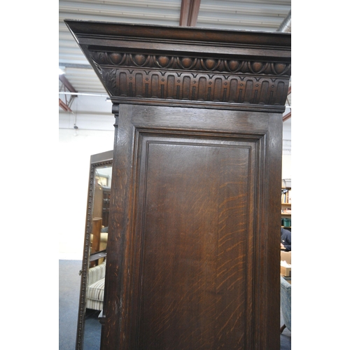 1334 - AN EARLY 20TH CENTURY HAMPTON AND SONS OF PALL MALL EAST LONDON, CARVED OAK COMPACTUM WARDROBE, comp... 