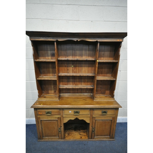 1339 - 20TH CENTURY OAK DRESSER, top with an arrangement of shelving, over a base of three drawers and two ... 