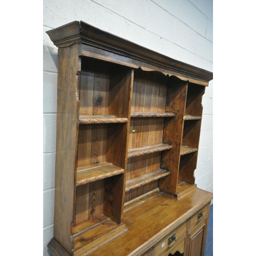 1339 - 20TH CENTURY OAK DRESSER, top with an arrangement of shelving, over a base of three drawers and two ... 