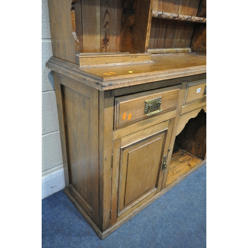 1339 - 20TH CENTURY OAK DRESSER, top with an arrangement of shelving, over a base of three drawers and two ... 