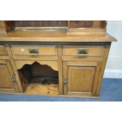 1339 - 20TH CENTURY OAK DRESSER, top with an arrangement of shelving, over a base of three drawers and two ... 