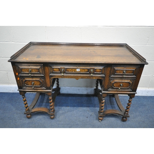 1340 - AN EARLY 20TH CENTURY OAK PEDASTAL SIDEBOARD, with a gallery top over five drawers with brass drop h... 