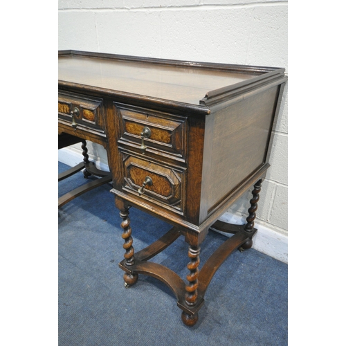 1340 - AN EARLY 20TH CENTURY OAK PEDASTAL SIDEBOARD, with a gallery top over five drawers with brass drop h... 