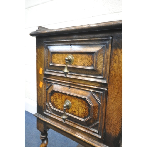 1340 - AN EARLY 20TH CENTURY OAK PEDASTAL SIDEBOARD, with a gallery top over five drawers with brass drop h... 